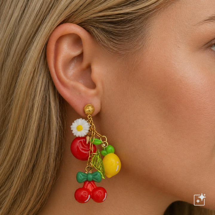 Värikkäät hedelmä- ja kukkakorvakorut – roikkuvat kirurginterästä