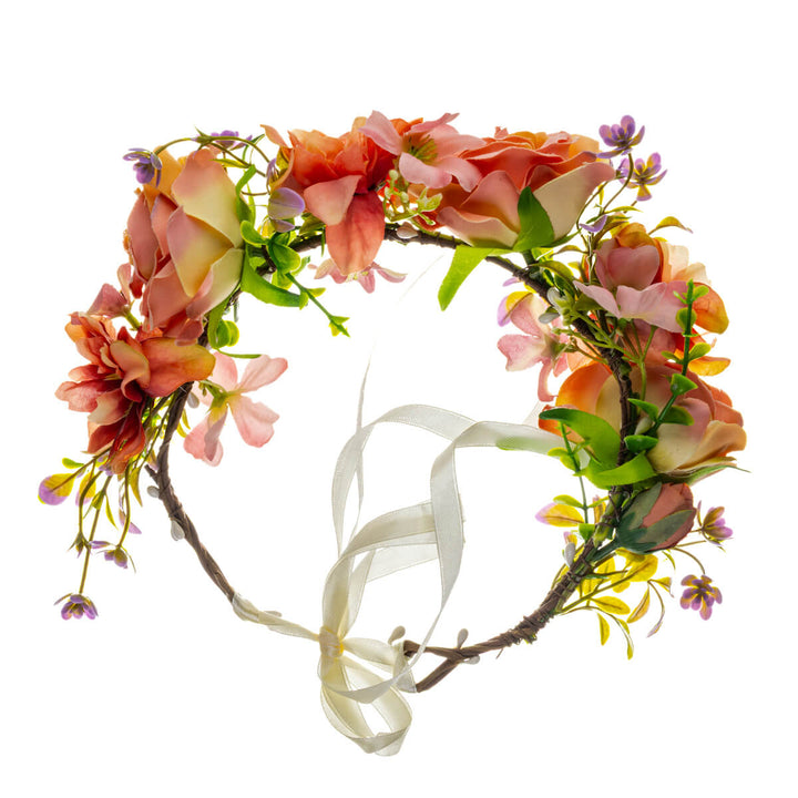 A soft peach-colored floral wreath with large flowers