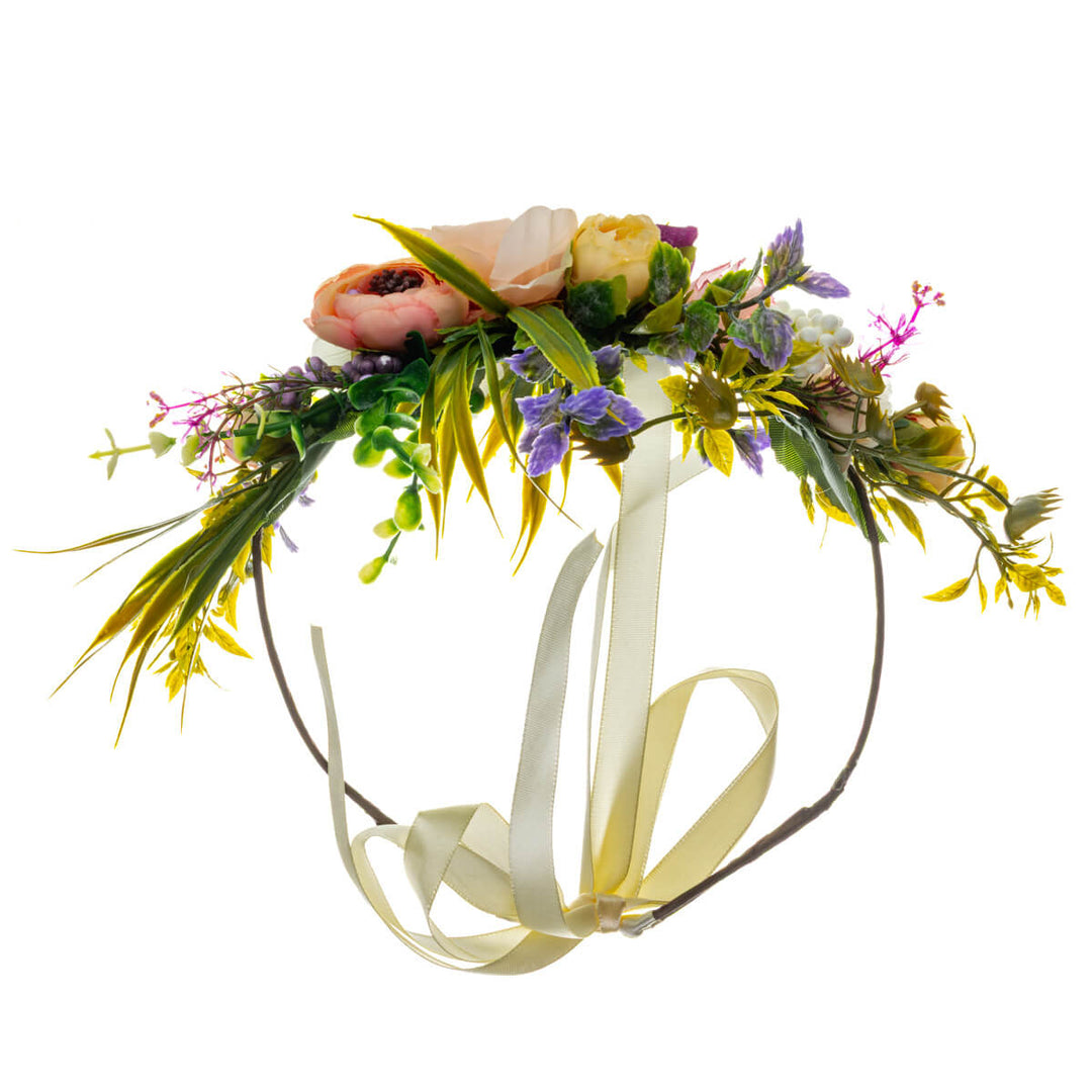 A romantic floral wreath in shades of peach and violet