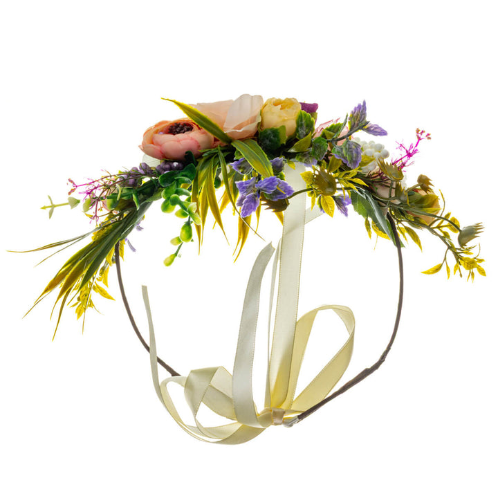 A romantic floral wreath in shades of peach and violet