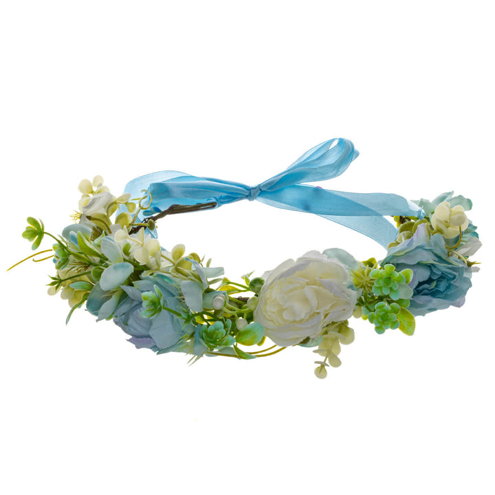 A light blue wreath with white flowers