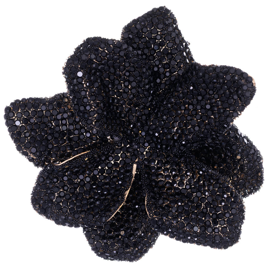 Iso kimalteleva kukka rintakoru lasikivillä