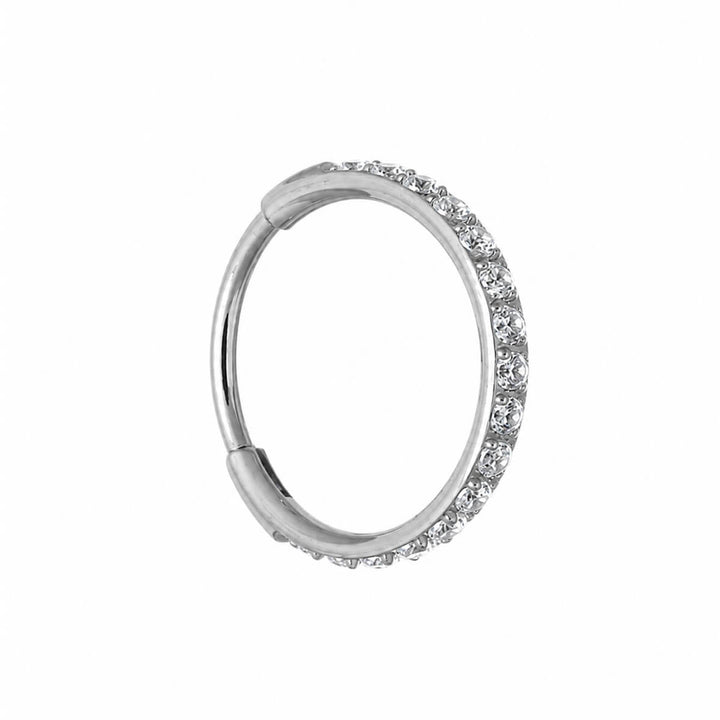 Saranallinen lävistysrengas CZ kivellinen clicker 1.2mm (Titaani G23)
